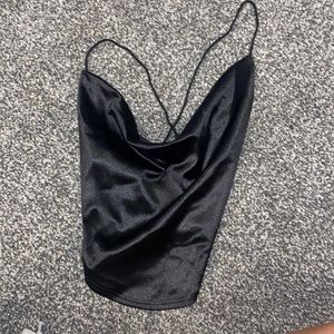 Sheer top with open back. Great for a date night.